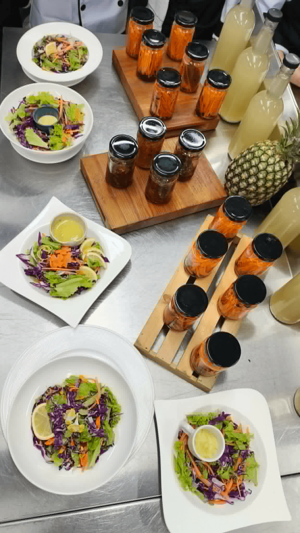 Preserved vegetables, salads, and bottled drinks prepared in the program kitchen